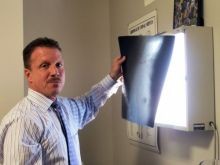 Dr. Dail examing x-rays